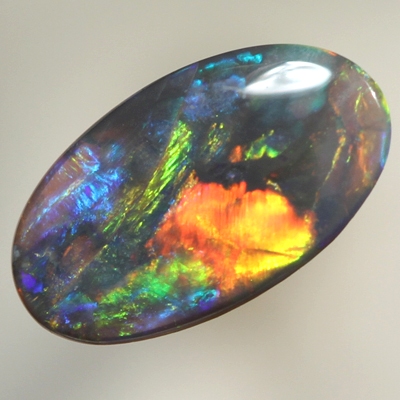 SOLID BLACK OPAL Bright reds over blues
